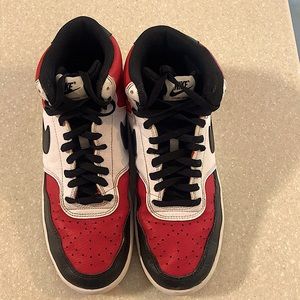 Size 9.5 Nike Court Vision red, black and white sneakers.